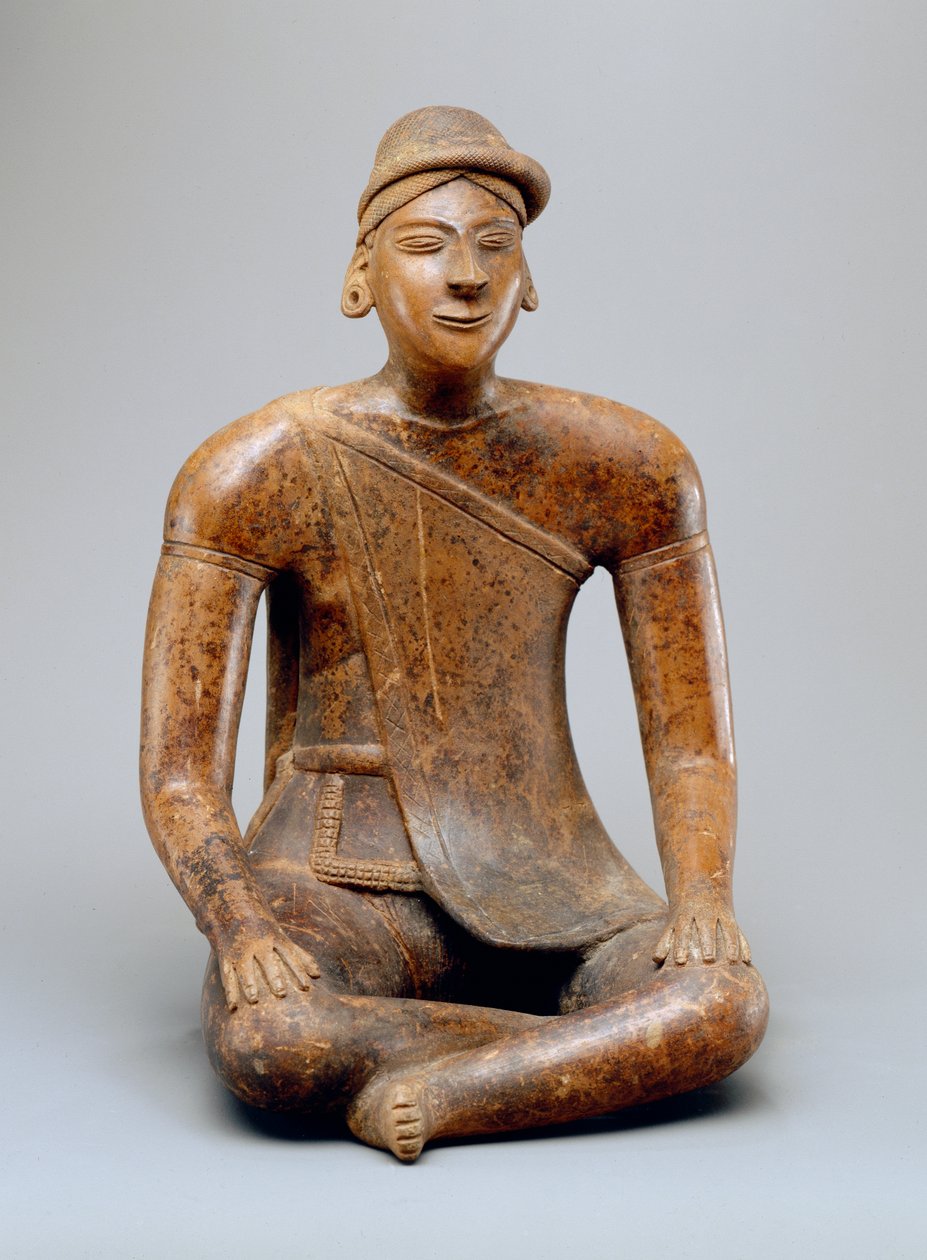 Macho sentado com capa (louça de barro) de Colima Culture