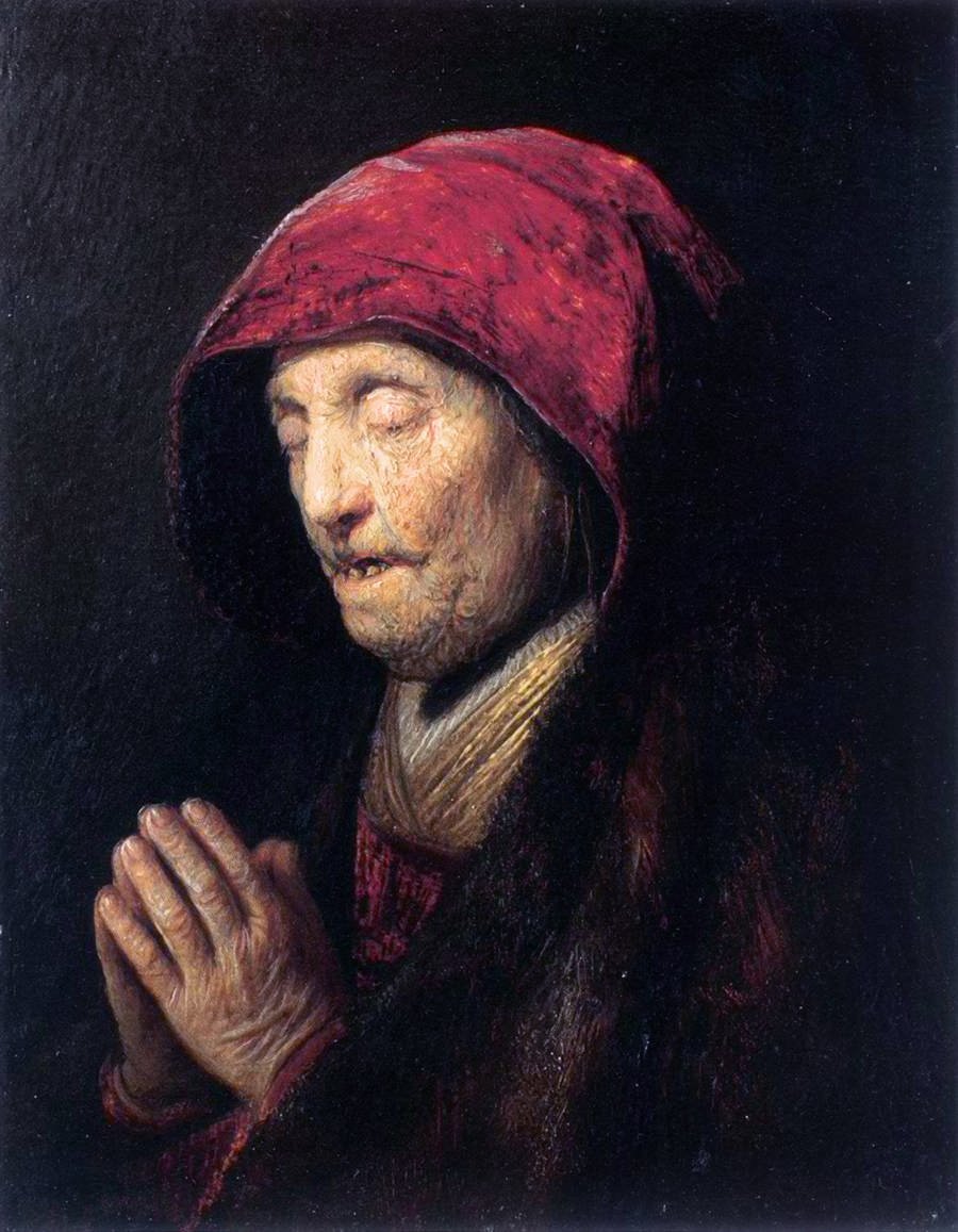 Mulher velha rezando de Rembrandt van Rijn